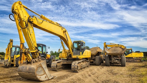 Heavy equipment machines in an outdoor environment